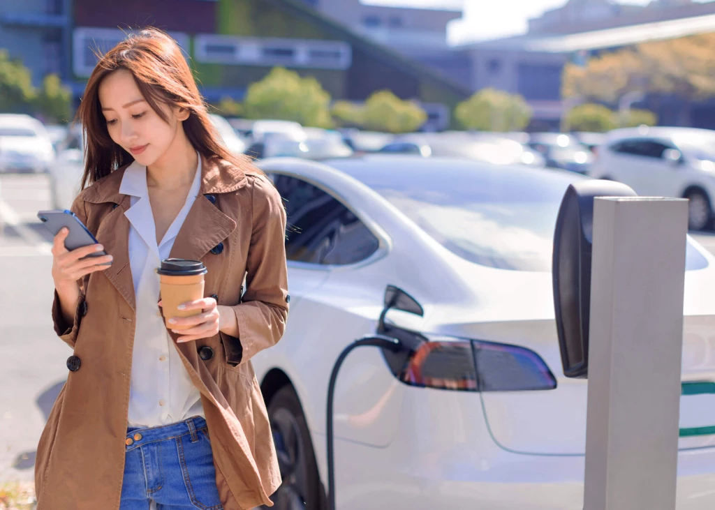 Women next to an EV charging
