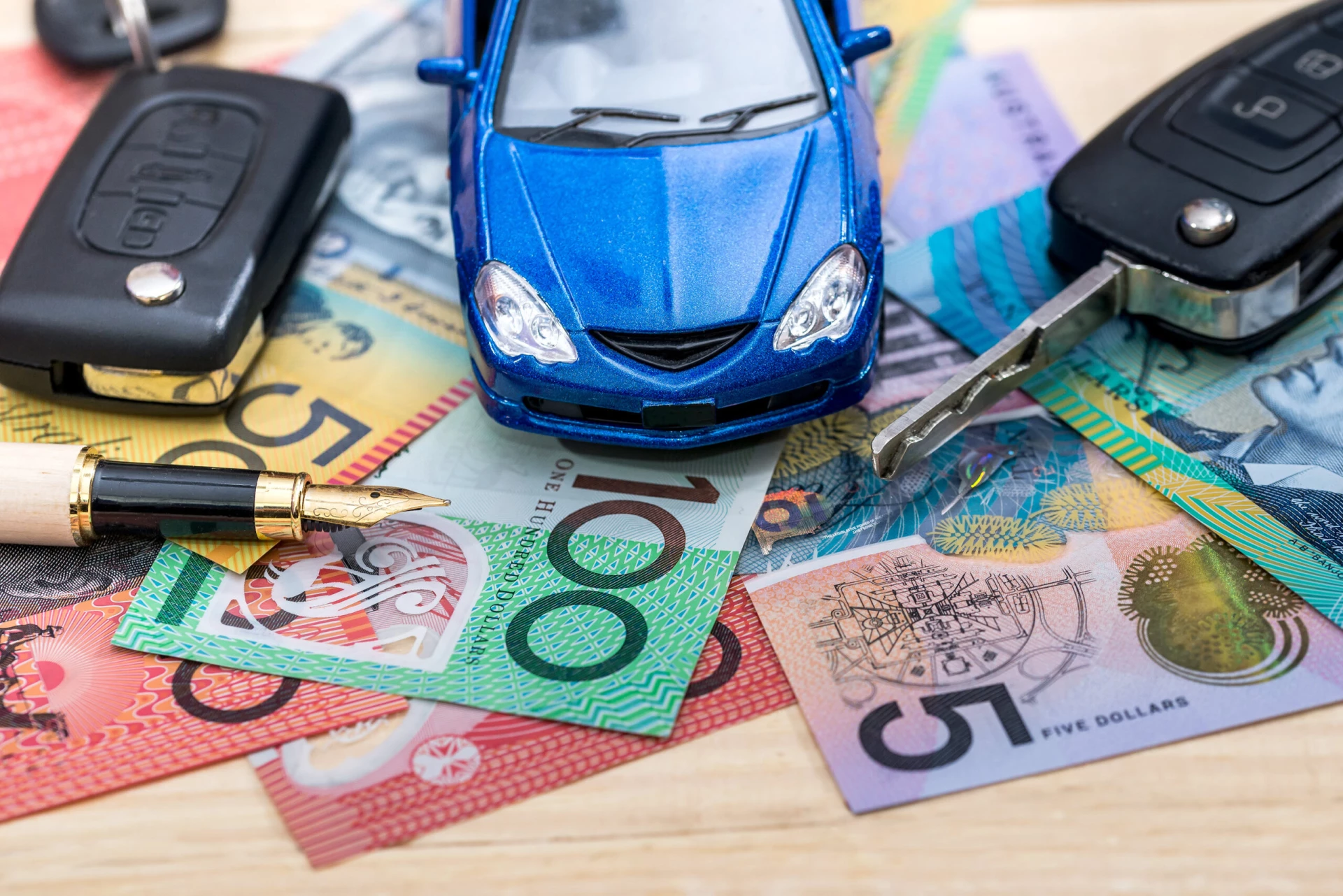 car-ownership-costs-toy-car-on-notes