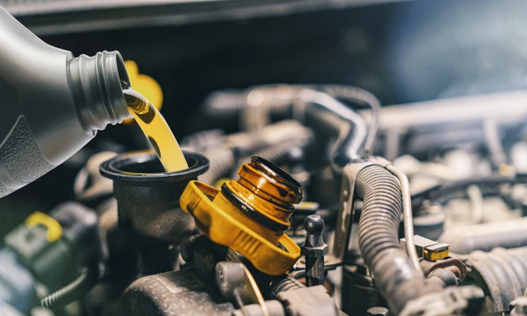 Oil being replaced in a car engine