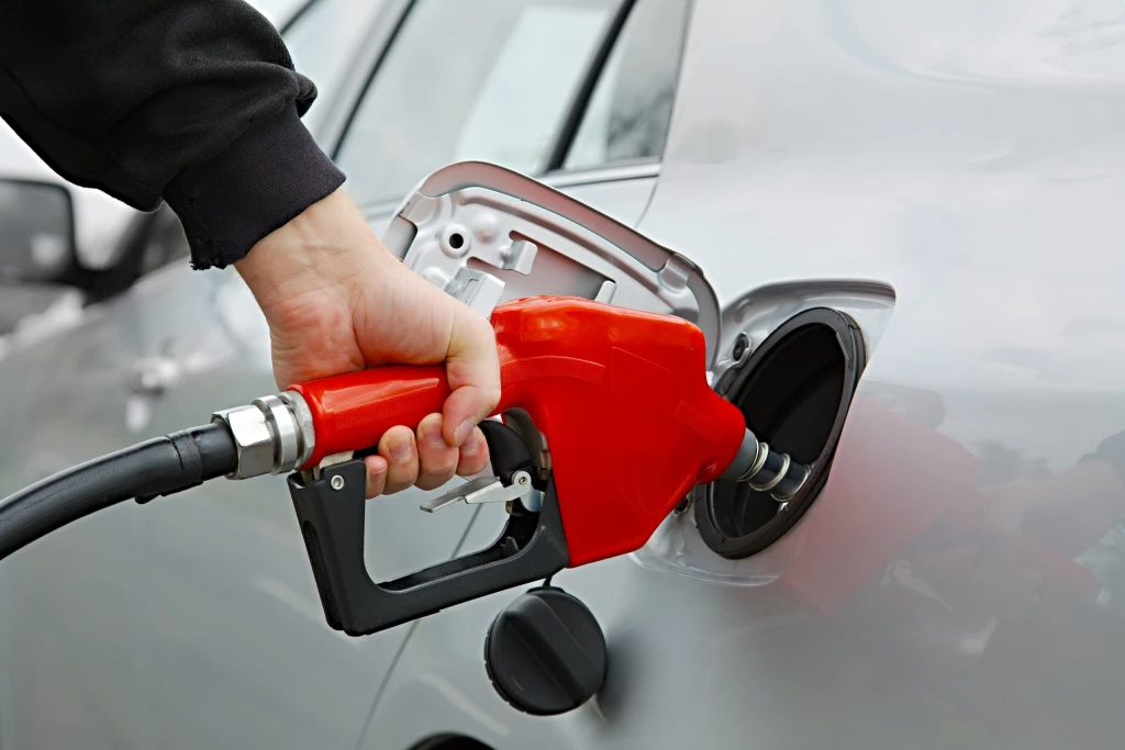 A driver fuelling up their car
