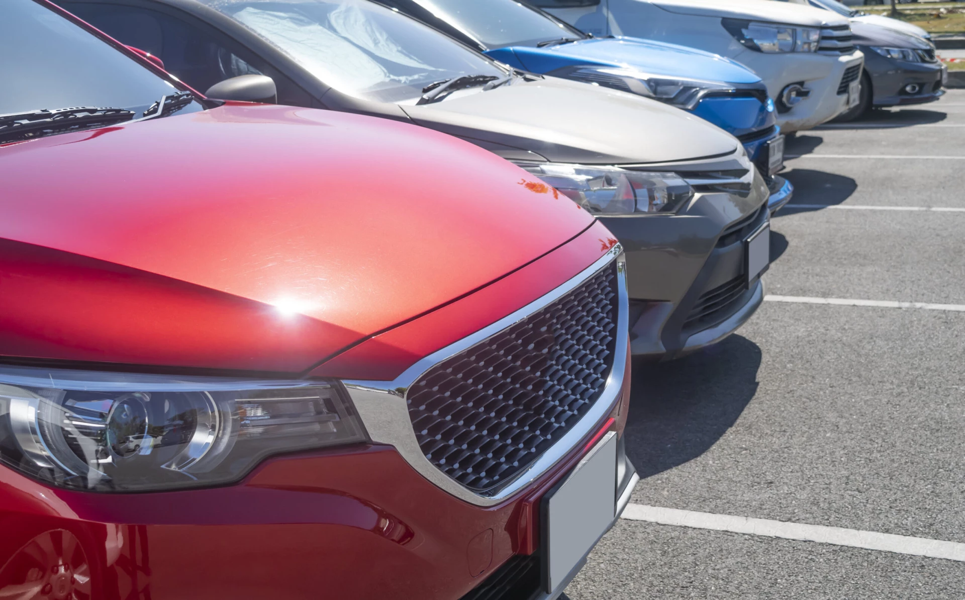 new-vs-used-car-row-of-cars-at-dealer