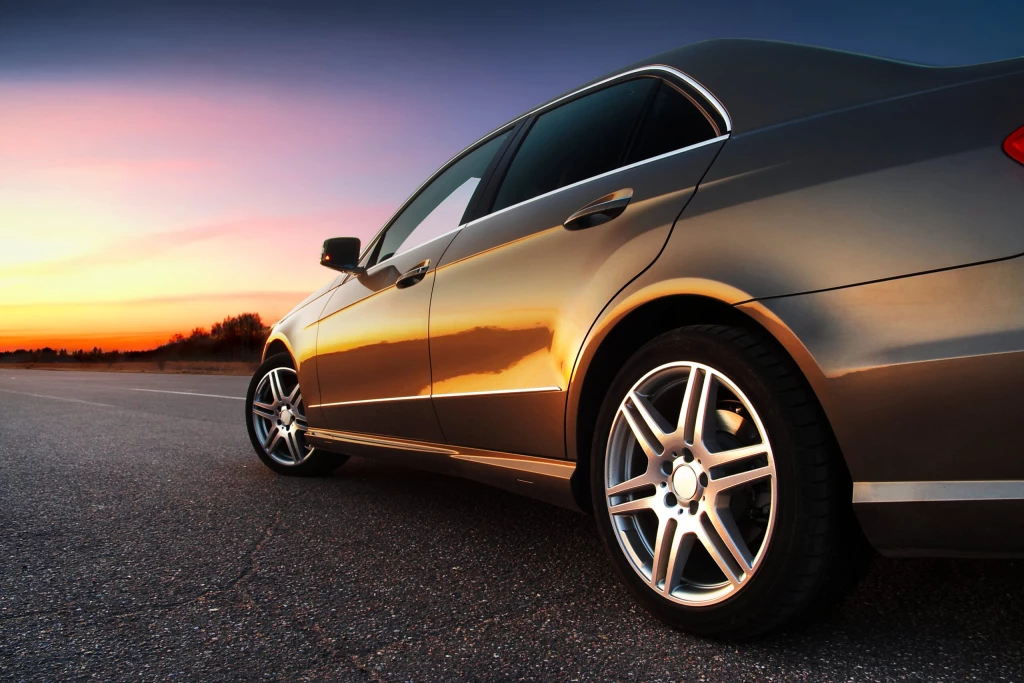 A car on the road at sunset