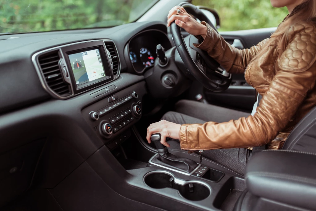 An Australian driver changing gears in their car