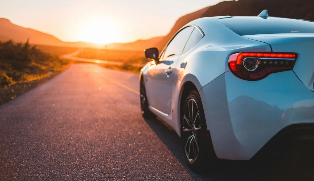 Electric car driving on an open road in Australia.